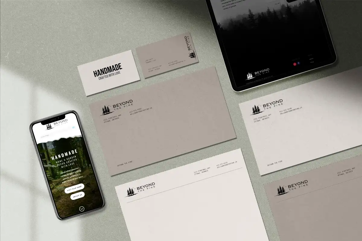 Brand logo applied across business cards, signage, and merchandise